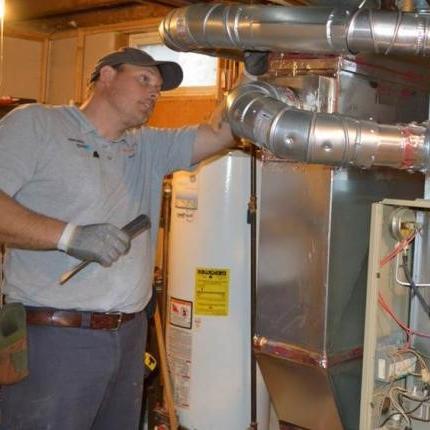 someone servicing residential HVAC equipment